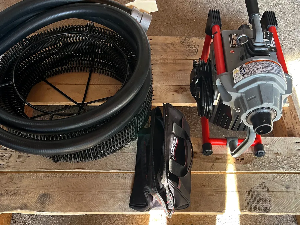 Drain cleaning machine and cable