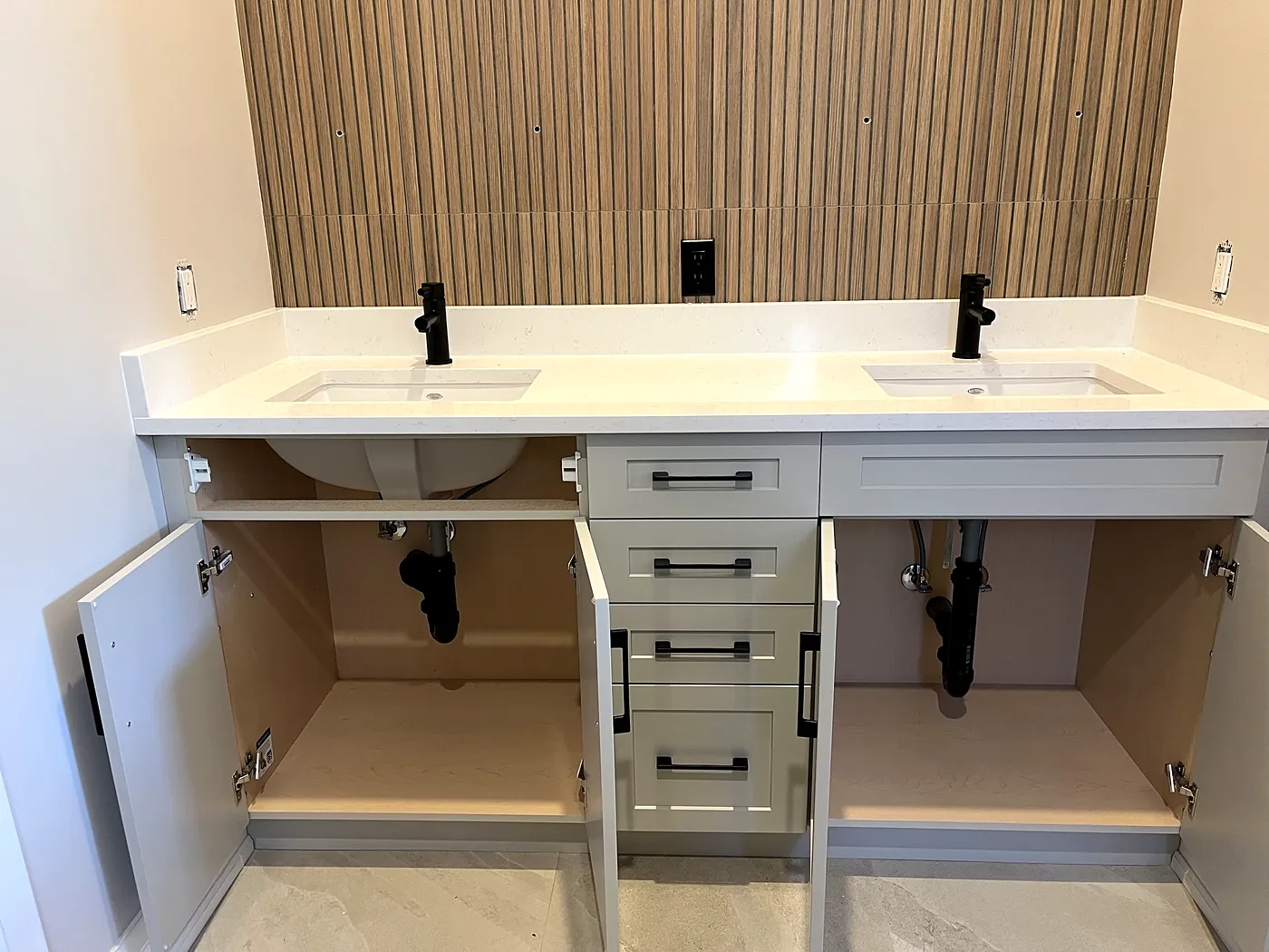 New double vanity with two undermount sinks and black faucets